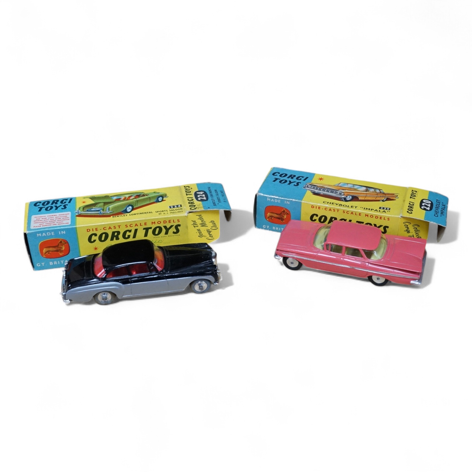 Two boxed Corgi Toys cars; a Bentley Continental Sports Saloon (224) in black and silver livery, with spare wheel, together with a Chevrolet Impala (220) in salmon pink. Condition - good, minor wear and rubbing to boxes.